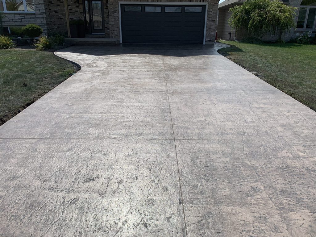 Stamped concrete driveway at a brick home in Southwestern Ontario